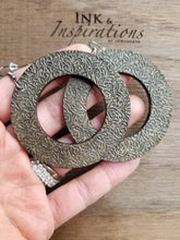 Load image into Gallery viewer, Espresso wood hoop earrings with engraved detail and gold accents

