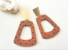 Load image into Gallery viewer, Koralyn coral wood hoop earrings with dark sunburst pattern and brass geometric tops
