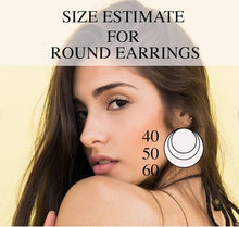 Load image into Gallery viewer, Metallic wood earrings with engraved starburst pattern in a teardrop shape
