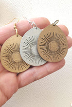 Load image into Gallery viewer, Metallic wood teardrop earrings with engraved sunburst design in gold, silver, and bronze finishes
