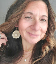 Load image into Gallery viewer, Close-up of metallic wood teardrop statement earrings with sunburst engraving
