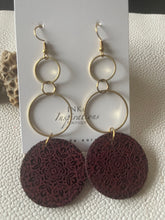 Load image into Gallery viewer, Burgundy wood mandala earrings showing the painted backs and gold-tone geometric dangle hardware
